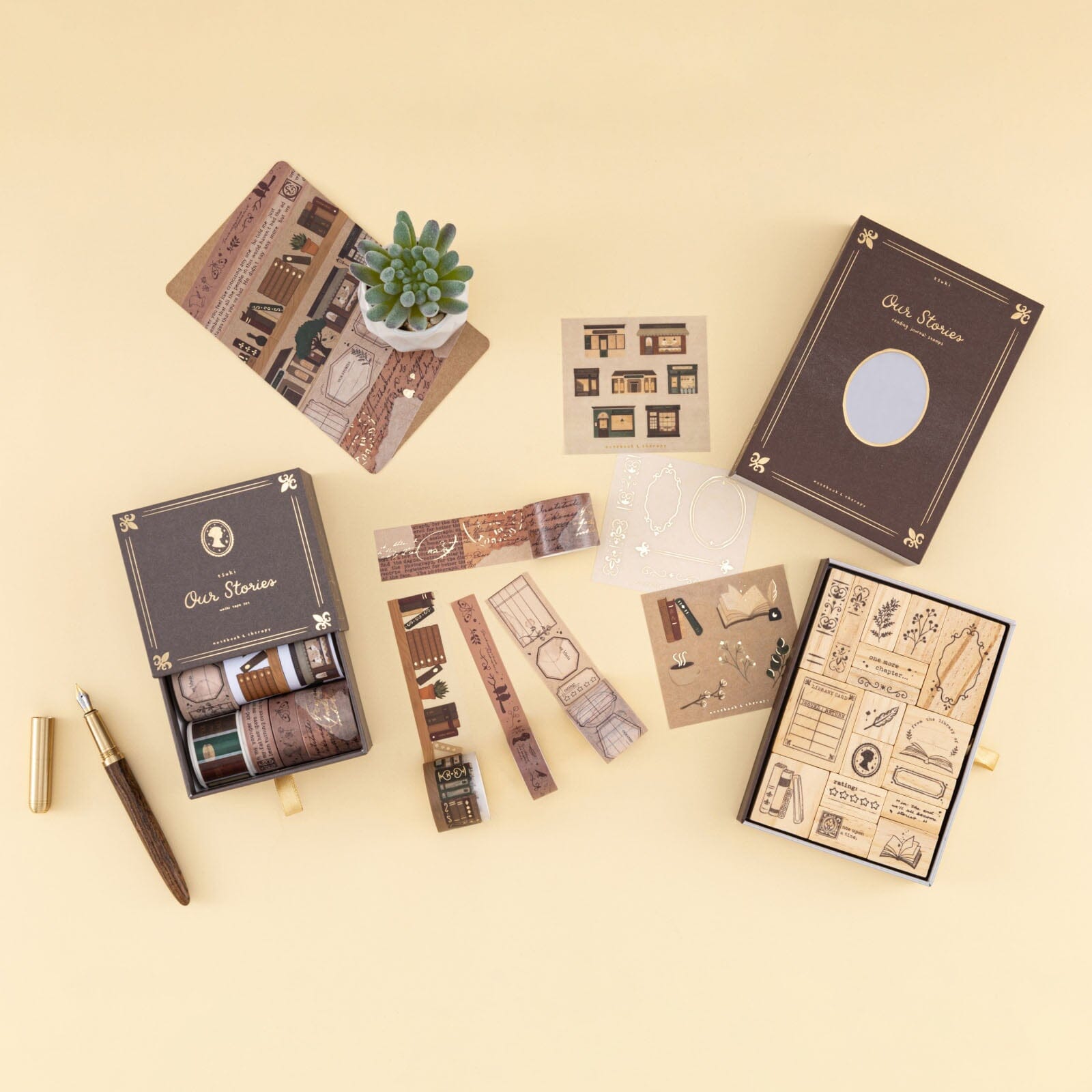 Our Stories collection flatlay with washi tapes and rubber stamps