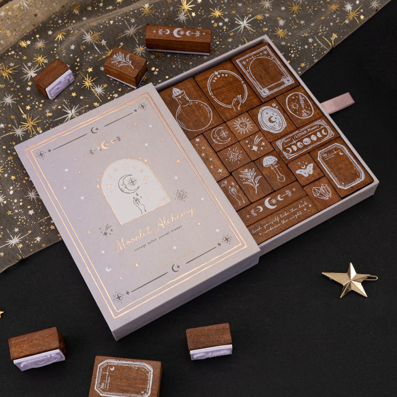 Tsuki ‘Moonlit Alchemy’ Bullet Journal Stamp Set opened drawer box with 19 wooden stamps inside with witchy icons