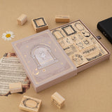 Tsuki Light Academia bullet journal stamp set with opened drawer style box reveaing 16x Light Academia themed stamps