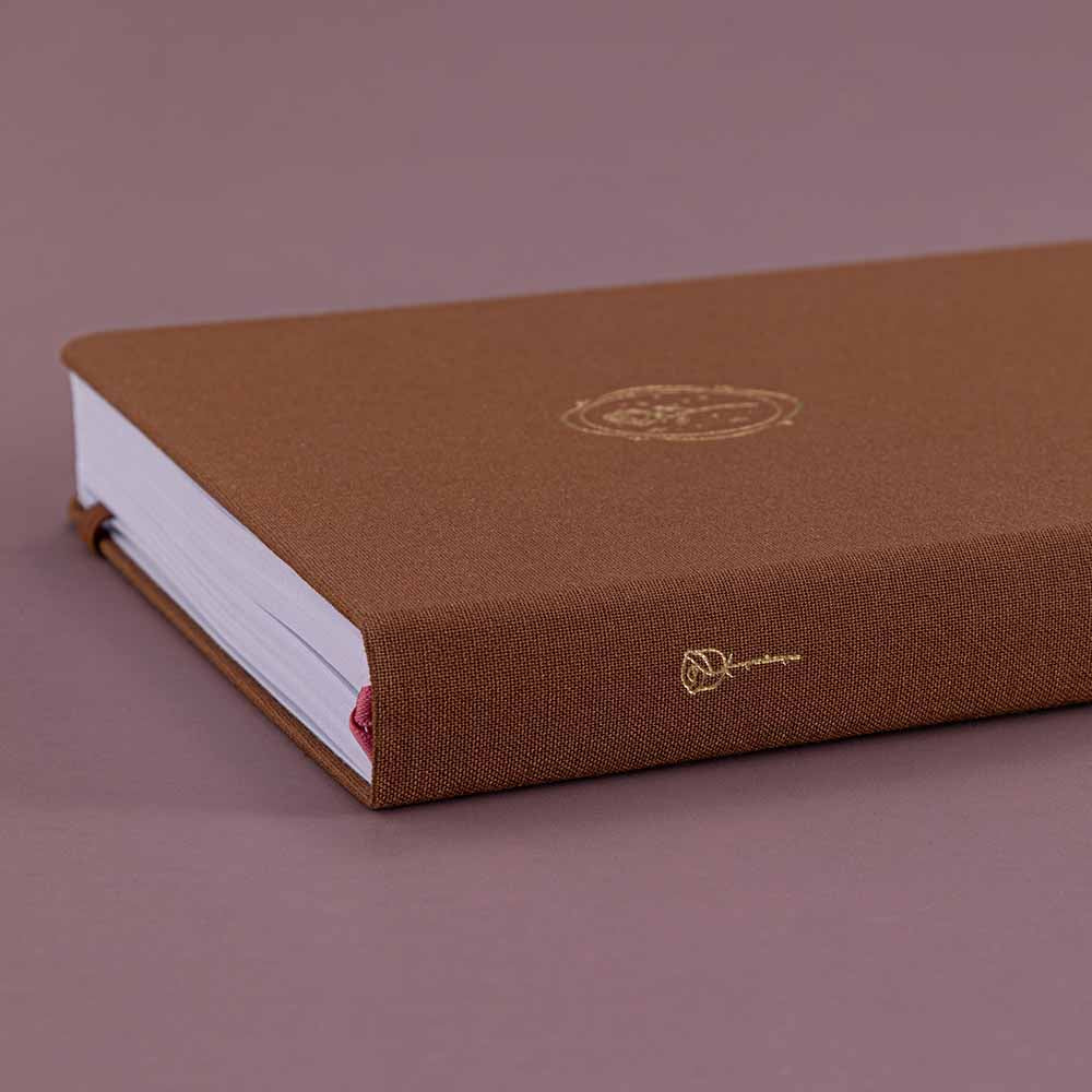 Close up of Tsuki ‘Vintage Rose’ Limited Edition Bullet Journal on mauve background
