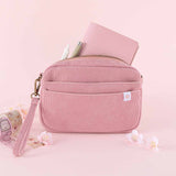 Tsuki ‘Sakura Journey’ Travel Pouch with Tsuki ‘Sakura Journey’ Limited Edition Travel Notebook and pens inside with Tsuki ‘Sakura Journey’ Vintage Journal Washi Tape Set with cherry blossoms in pink background