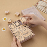 Hand picking up mirror bullet journal stamp from the Light Academia bullet journal stamp set