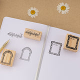 Frame stamps and music note stamps on white bullet journal dotted paper