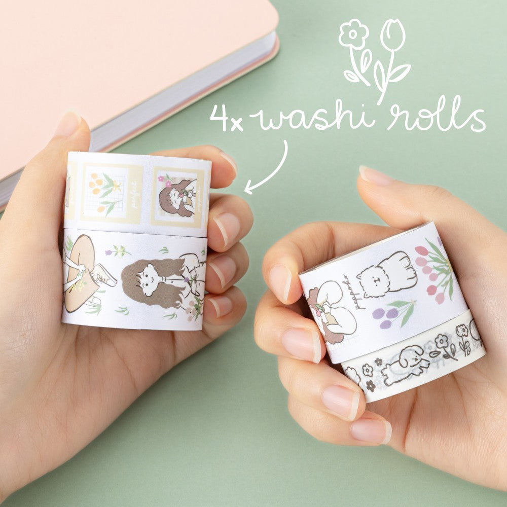 Hands holding 4 washi rolls