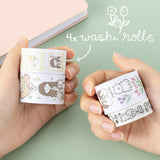 Hands holding 4 washi rolls