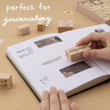 Hands staamping music notes stamp on bullet journal and text that says “perfect for journaling”