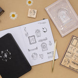 Light Academia themed stamps on bullet journal page with Tsuki Lunar Notes bullet journal