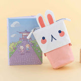 Tsuki ‘Four Seasons’ Embroidered Pop-Up Pencil Case by Notebook Therapy x Milkkoyo in bunny with Tsuki ‘Four Seasons: Summer Edition’ Bullet Journal in honey yellow background