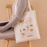 Tsuki ‘Vintage Kinoko’ Tote Bag on model’s arm in beige background