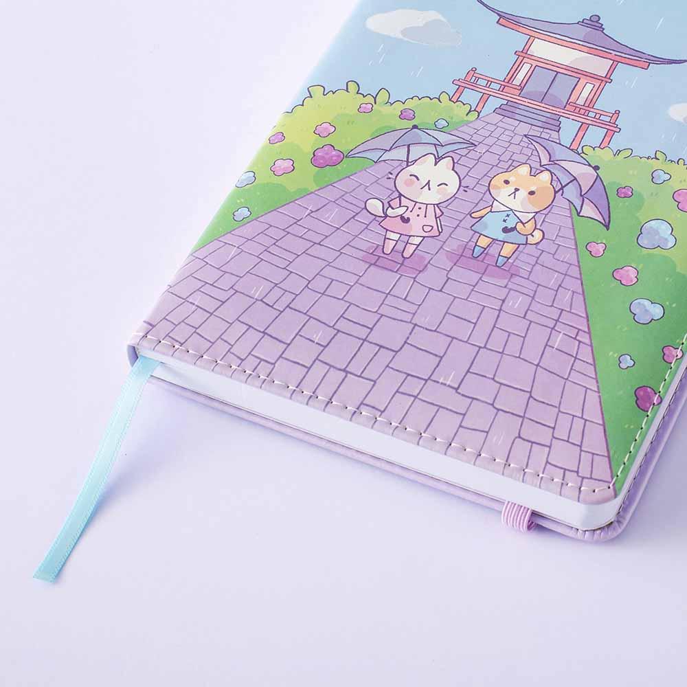 Close up of the front cover of Tsuki Four Seasons: Summer Edition Bullet Journal designed with @milkkoyo on lilac background