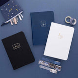 Tsuki ‘Winter Wishes’ Limited Edition Bullet Journal and Tsuki ‘Winter Journey’ Limited Edition Bullet Journal and Tsuki ‘Suzume’ Winter Limited Edition Bullet Journal with Tsuki ‘Dreams of Snow’ Holographic Washi Tapes and Tsuki ‘Dreams of Snow’ Pop-Up Pencil case in Starry Night on navy background