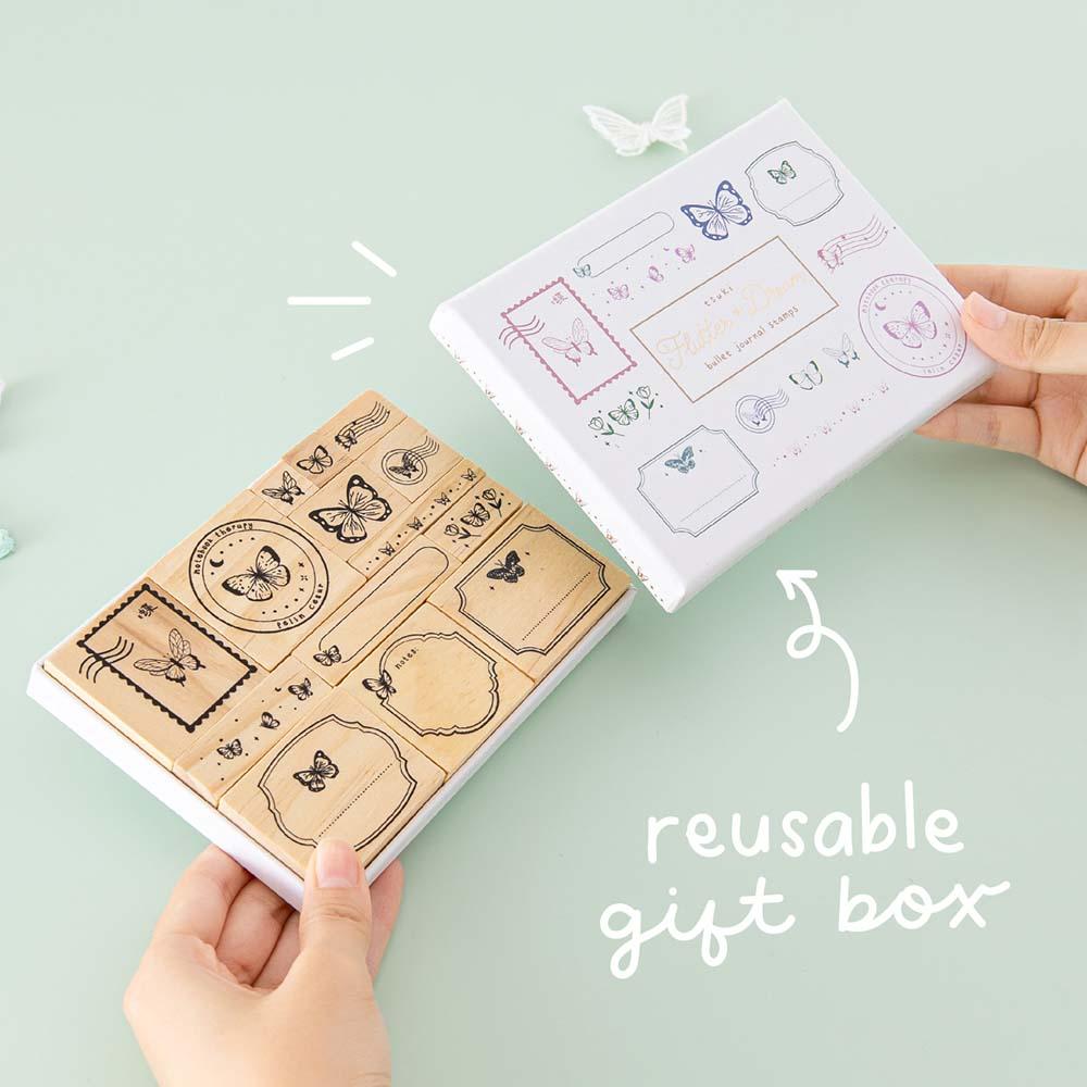Tsuki ‘Flutter + Dream’ Bullet Journal Stamp Set by Notebook Therapy x Pelinkan with reusable tsuki gift box held in hands in mint background