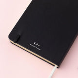 Close up of Tsuki Lunar Notes bullet journal back cover detail image on pink background