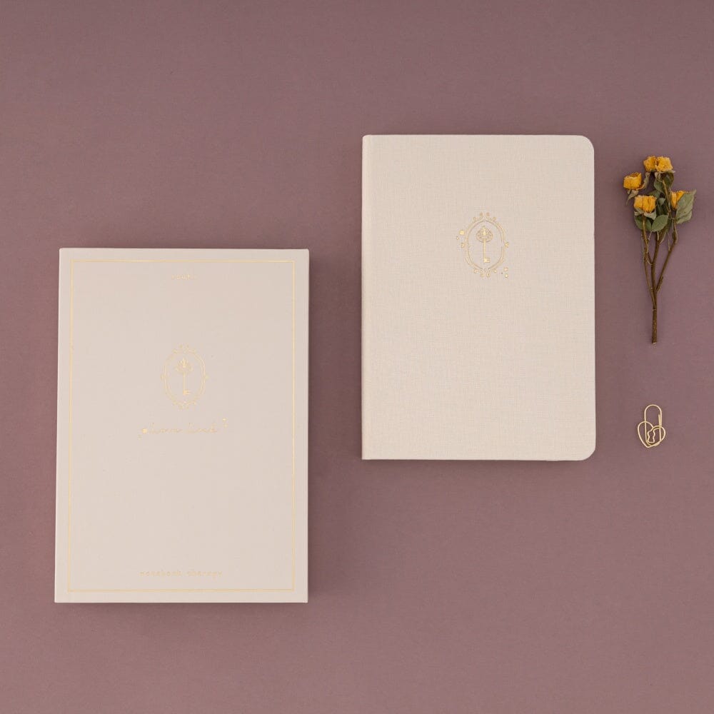 Flatlay of love lock box and notebook