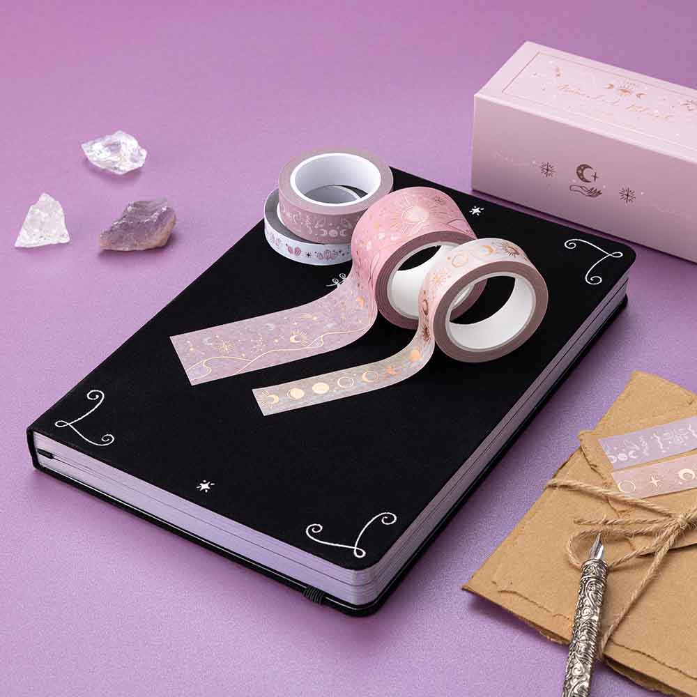 Tsuki ‘Moonlit Blush’ Washi Tape Set on Tsuki ‘Moonlit Spell’ Limited Edition Holographic Bullet Journal with scrapbook paper and amethyst stones on purple background