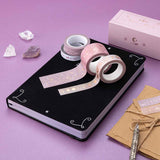 Tsuki ‘Moonlit Blush’ Washi Tape Set on Tsuki ‘Moonlit Spell’ Limited Edition Holographic Bullet Journal with scrapbook paper and amethyst stones on purple background