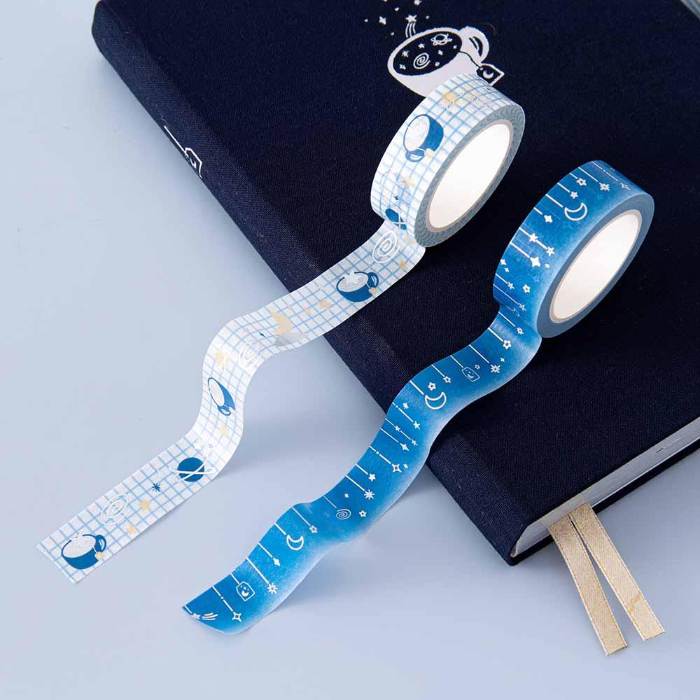 Close up of Tsuki ‘Cup of Galaxy’ Washi Tapes on Tsuki ‘Cup of Galaxy’ Limited Edition Holographic Bullet Journal cover on light blue background