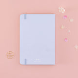 Back cover of Tsuki ‘Sakura Journey’ Limited Edition Bullet Journal with free bookmark gift with cherry blossom petals on pink background