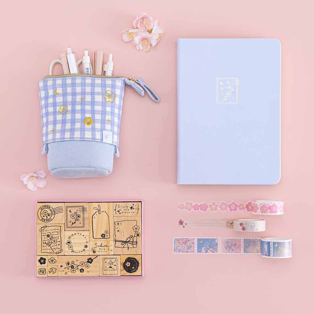 Tsuki ‘Sakura Journey’ Pop-Up Pencil Case with Tsuki ‘Sakura Journey’ Limited Edition Bullet Journal and Tsuki ‘Sakura Journey’ Bullet Journal Stamp Set and Tsuki ‘Sakura Journey’ Washi Tapes with cherry blossoms on light pink background