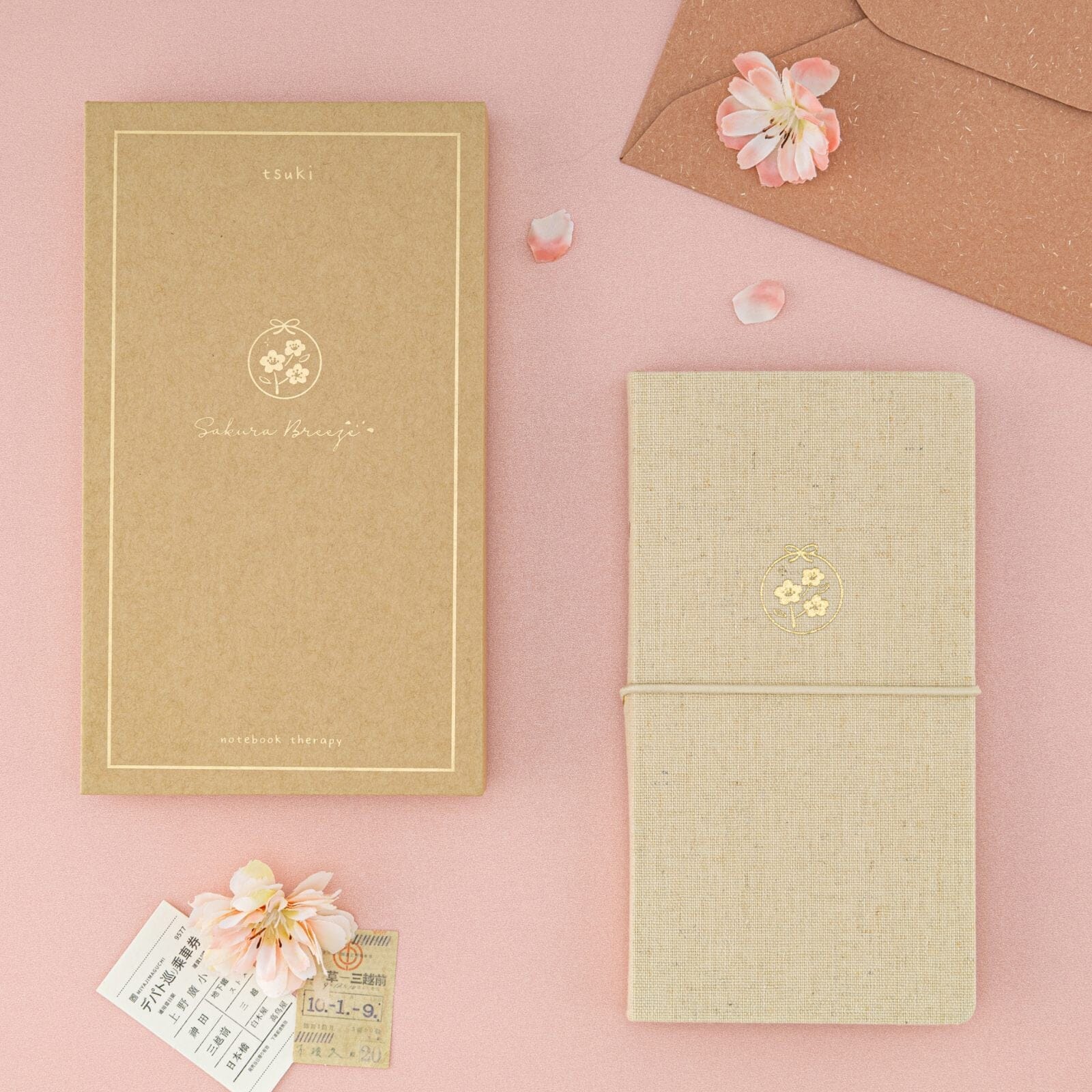 Flatlay of Tsuki ‘Sakura Breeze’ Kraft Paper Travel Notebook with box