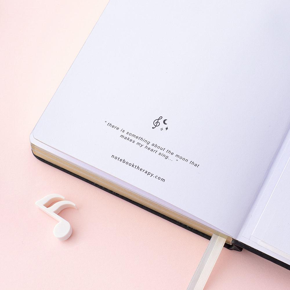 Close up of Tsuki Lunar Notes bullet journal last page image on pink background