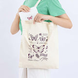 Tsuki ‘Flutter + Dream’ Tote Bag by Notebook Therapy x Pelinkan on model’s arm held open with Tsuki Cloud White ‘Flutter + Dream’ Limited Edition Bullet Journal by Notebook Therapy x Pelinkan inside in light grey background