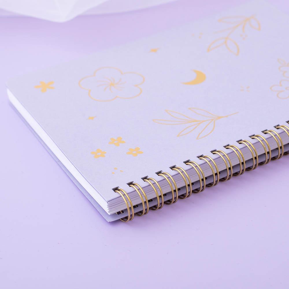Close up on Tsuki lilac taro ringbound spine in lilac background