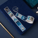 Tsuki Ocean Edition gold foil stamp washi with deep blue Tsuki Gentle Giant luxury edition bullet journal and gold pen on dark blue background