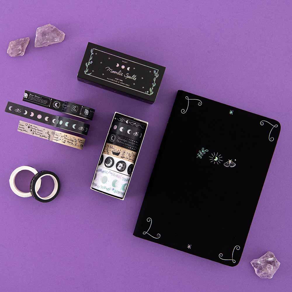 Tsuki ‘Moonlit Spell’ Limited Edition Holographic Bullet Journal with Tsuki ‘Moonlit Spell’ Washi Tape Set with amethyst stones on purple background