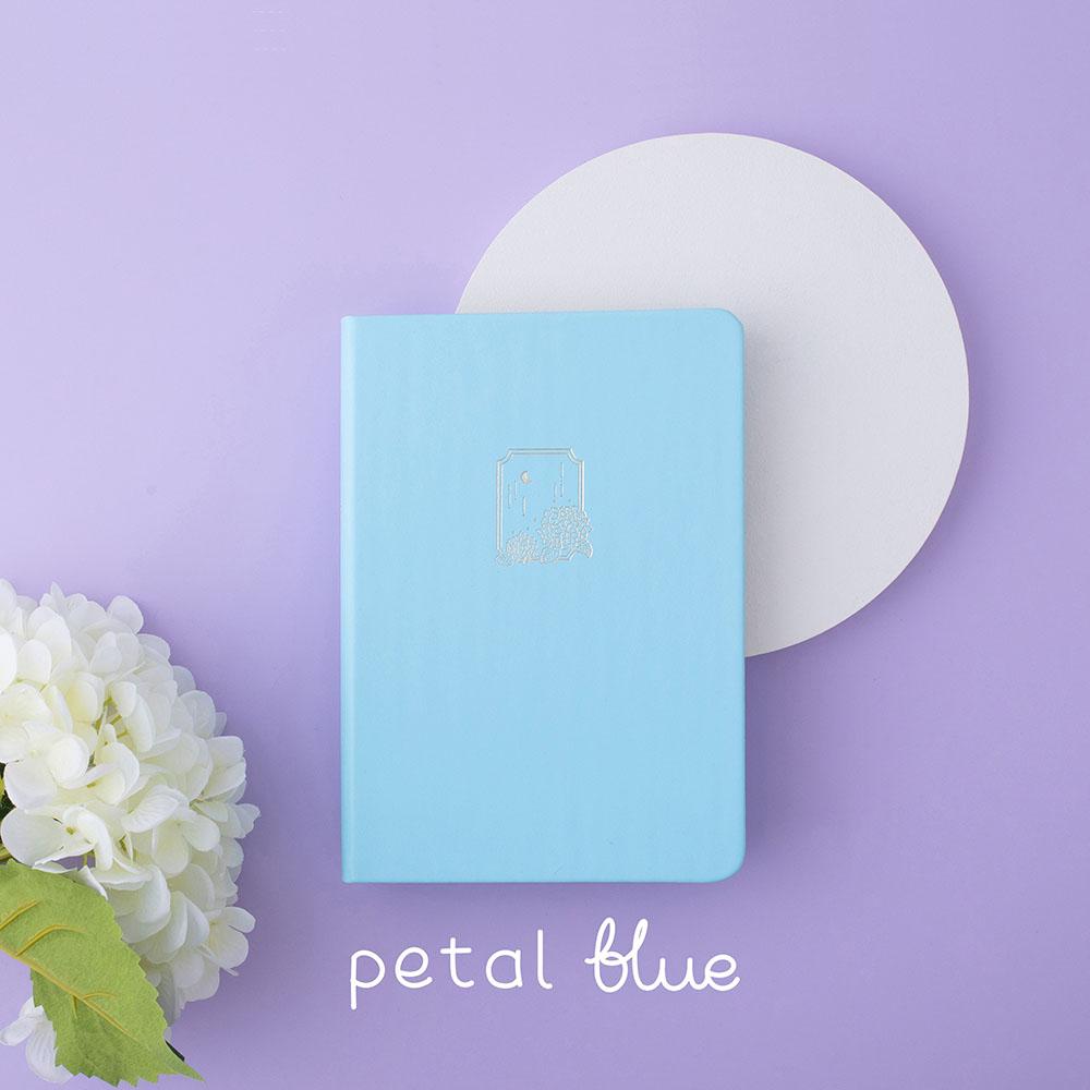 Tsuki Endless Summer Limited Edition Bullet Journal in Petal Blue with white circle and white hydrangea flowers on lilac background