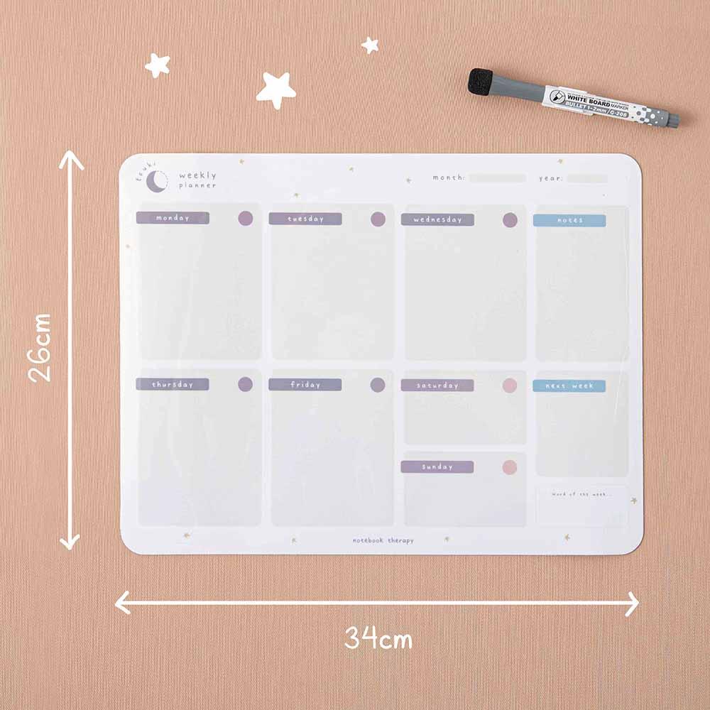 Tsuki Reusable Weekly Planner measuring 34 x 26 cm with dry erase marker on smooth wallpaper surface