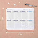 Tsuki Reusable Weekly Planner measuring 34 x 26 cm with dry erase marker on smooth wallpaper surface