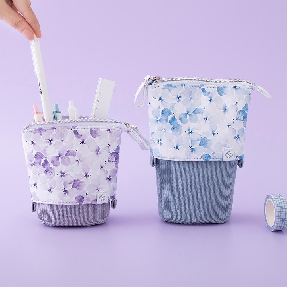 Tsuki Endless Summer Pop-Up Pencil cases in Lilac Bloom and Petal Blue with pens and ruler with Tsuki Endless Summer Washi Tape roll in lilac background