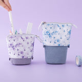 Tsuki Endless Summer Pop-Up Pencil cases in Lilac Bloom and Petal Blue with pens and ruler with Tsuki Endless Summer Washi Tape roll in lilac background
