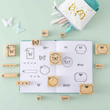 Tsuki ‘Flutter + Dream’ Bullet Journal Stamp Set by Notebook Therapy x Pelinkan on open Tsuki Teal Sky ‘Flutter + Dream’ Limited Edition Bullet Journal by Notebook Therapy x Pelinkan page spread with Tsuki ‘Flutter + Dream’ Pop-Up Pencil Case by Notebook Therapy x Pelinkan with butterflies on mint background