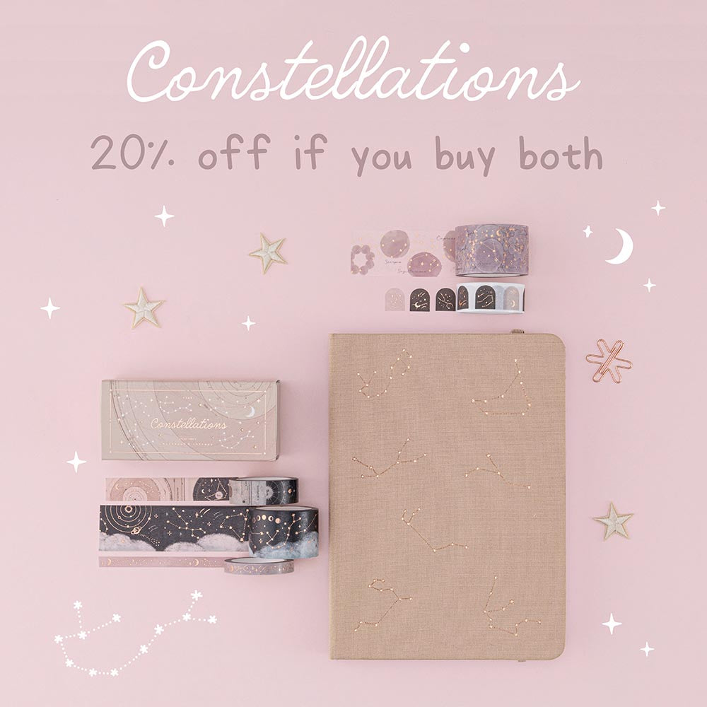 Flatlay of beige constellations bullet journal and washi tape set with the words “constellations 20% off if you buy both”