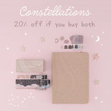 Flatlay of beige constellations bullet journal and washi tape set with the words “constellations 20% off if you buy both” 