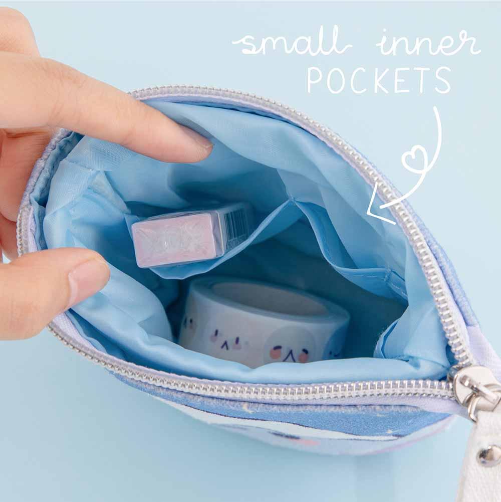 Close up of open Tsuki ‘Four Seasons’ Fuji Pop-Up Pencil Case by Notebook Therapy x Milkkoyo with small inner pockets held in hands on light blue background