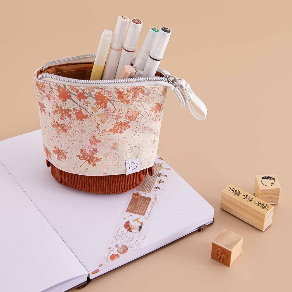 Tsuki ‘Maple Dreams’ Pop-Up Pencil case with pens inside on Tsuki ‘Nara’ Limited Edition Bullet Journal with Tsuki ‘Maple Dreams’ Washi Tape and Tsuki ‘Maple Dreams Bullet Journal stamps on beige background