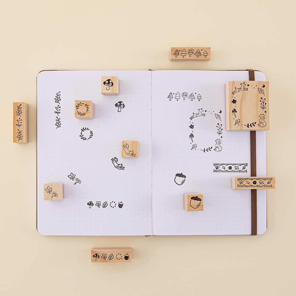 Tsuki ‘Maple Dreams’ Bullet Journal Stamp Set on open bullet journal spread on cream background