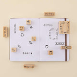 Tsuki ‘Maple Dreams’ Bullet Journal Stamp Set on open bullet journal spread on cream background