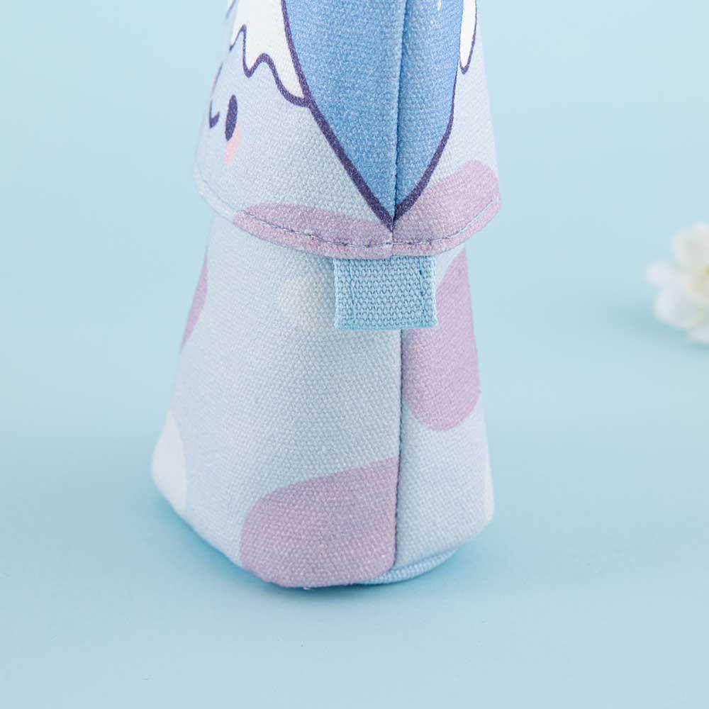 Close up of the base of Tsuki ‘Four Seasons’ Fuji Pop-Up Pencil Case by Notebook Therapy x Milkkoyo with white flower in light blue background