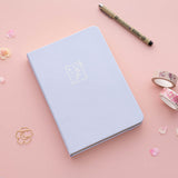 Tsuki ‘Sakura Journey’ Limited Edition Bullet Journal with free bookmark gift with pen and cherry blossom petals with Tsuki ‘Sakura Journey’ Washi Tape Set on pink background