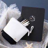 Tsuki Black Paper Limited Edition Hardcover Bullet Journal in Playful Orca with Tsuki Ocean Edition Pop-Up Pencil Case in Orca Black in white wooden basket with star netting on dark blue background