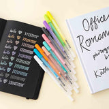 Gelly Roll Pens with open Tsuki Black Paper Limited Edition Hardcover Bullet Journal and book on buttermilk background