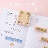 Tsuki ‘Four Seasons’ Bullet Journal Frame Stamp by Notebook Therapy x Milkkoyo with Tsuki ‘Four Seasons’ Washi Tapes on open bullet journal page spread on petal pink background