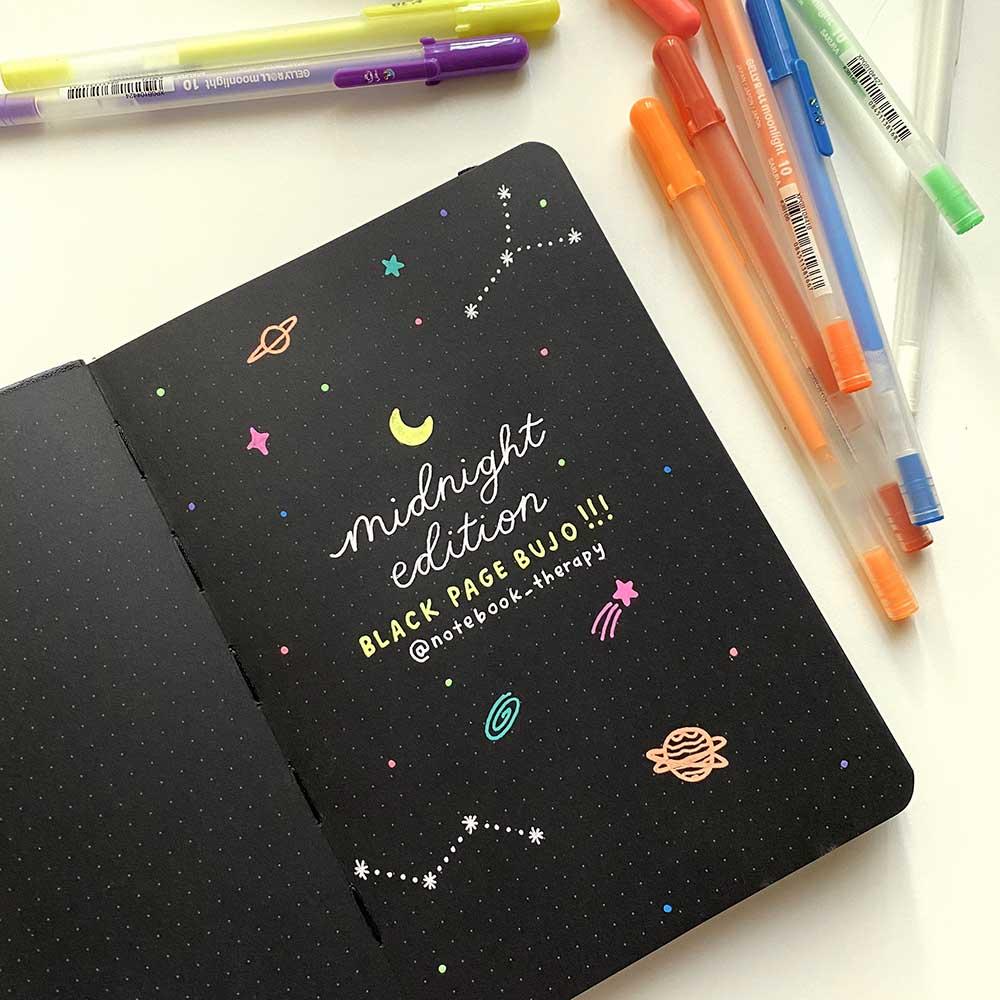 galaxy doodles on black page bullet journal using gelly roll moonlight set