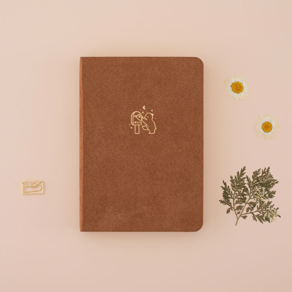 Tsuki Kuma brown velvet bear bullet journal with circle graphic showing kraft paper page