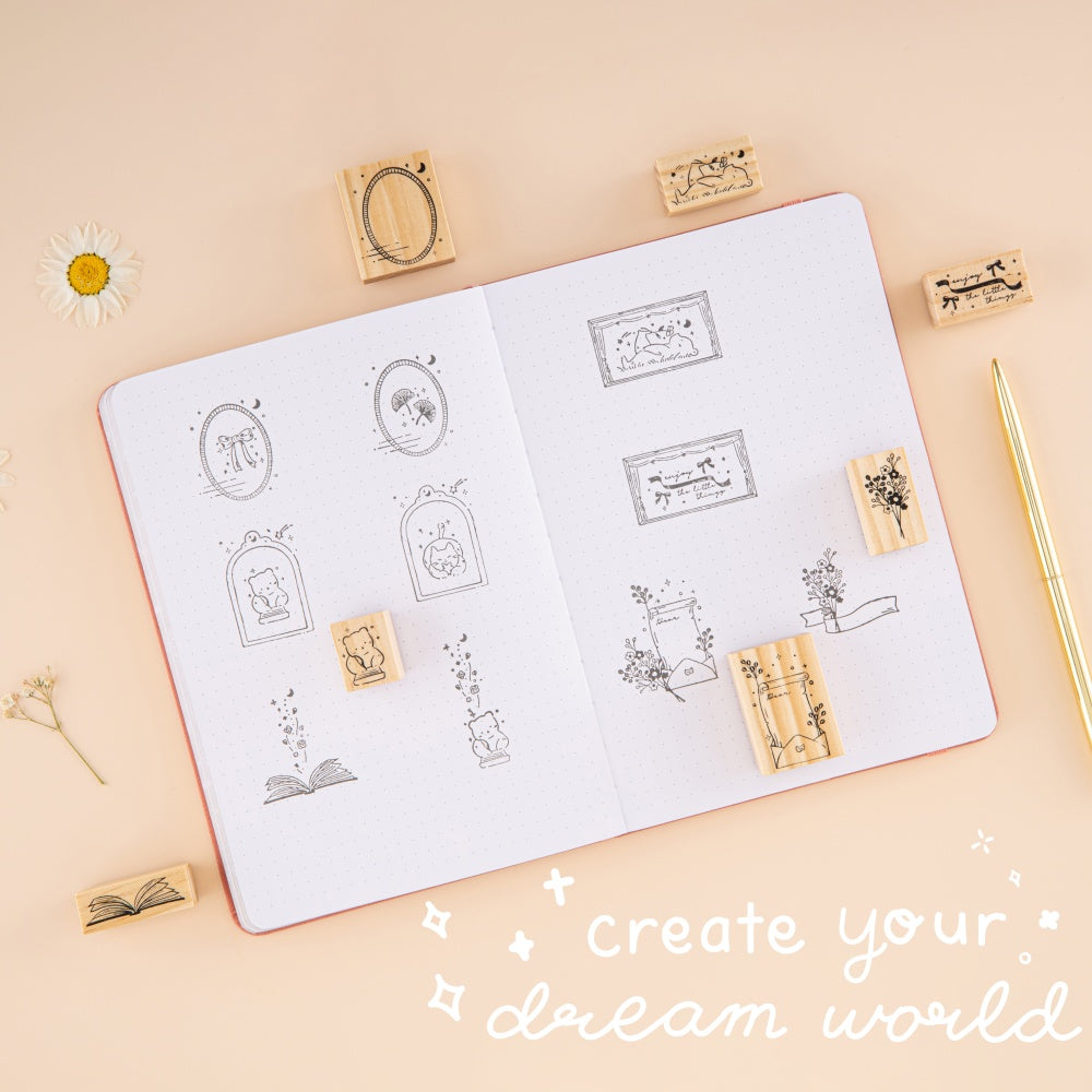 Stamp swatch on bullet journal with lettering ‘create your dream world’