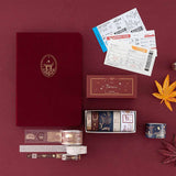 Flatlay of Tsuki Torii bundle set including red linen Torii bullet journal and washi tape box 